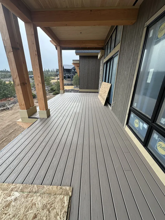 Siding gable corner with stone column and timber accents