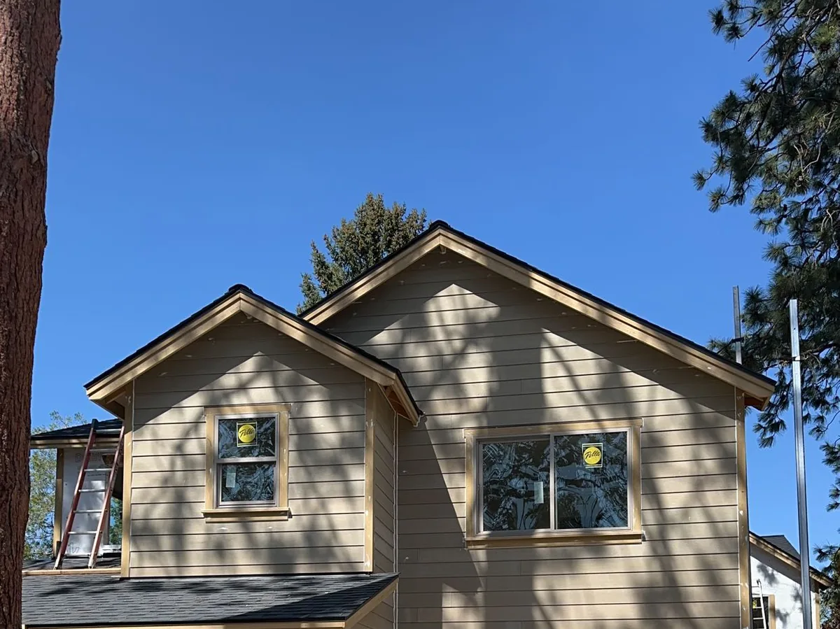 Two-story home framed with lumber staged on site
