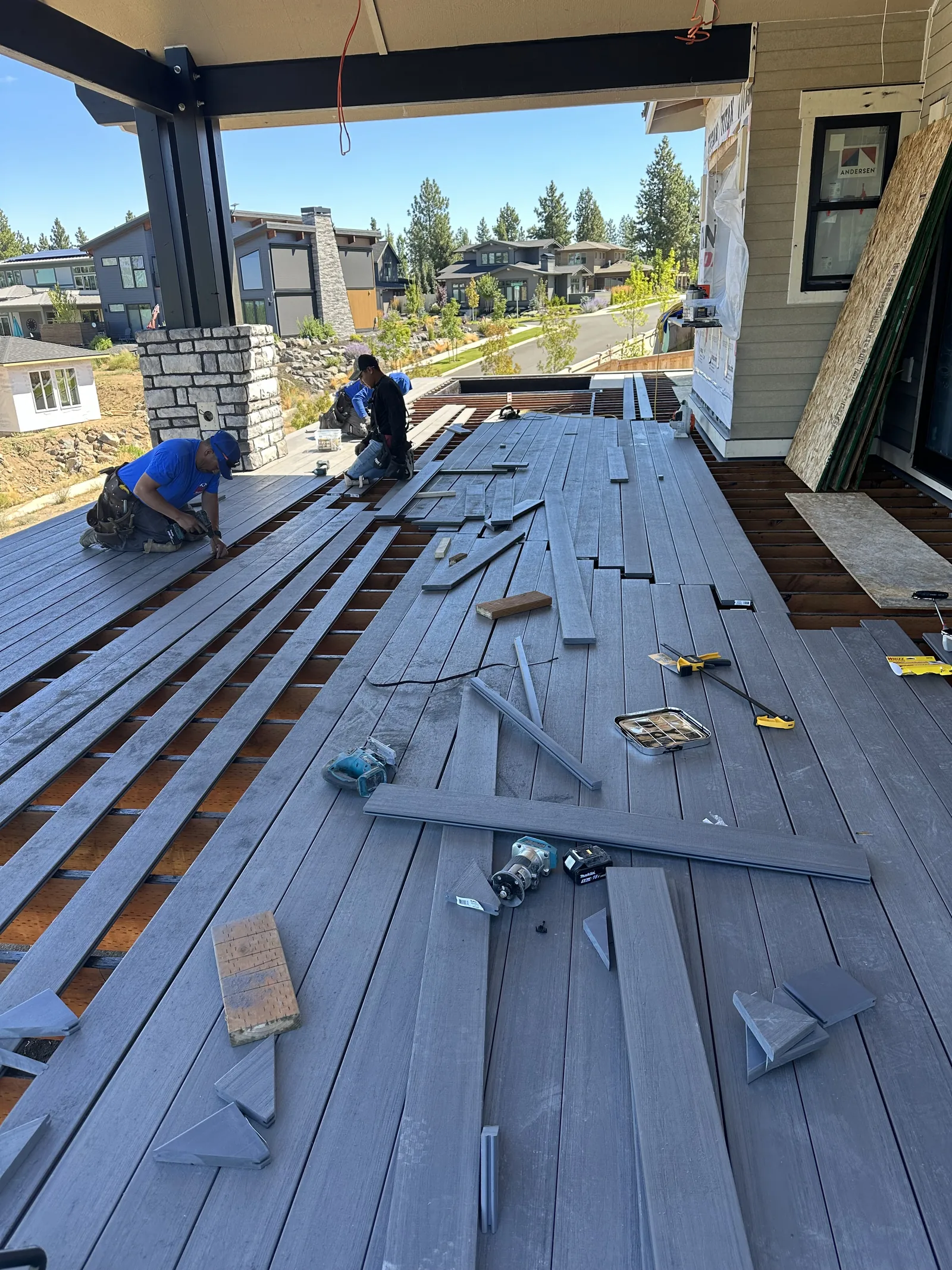 Roof deck with battens and panels staged during an active reroof