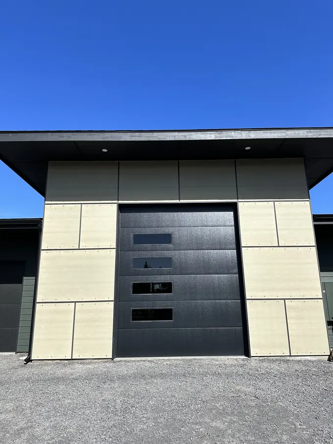 Modern cream panel cladding with black metal accents